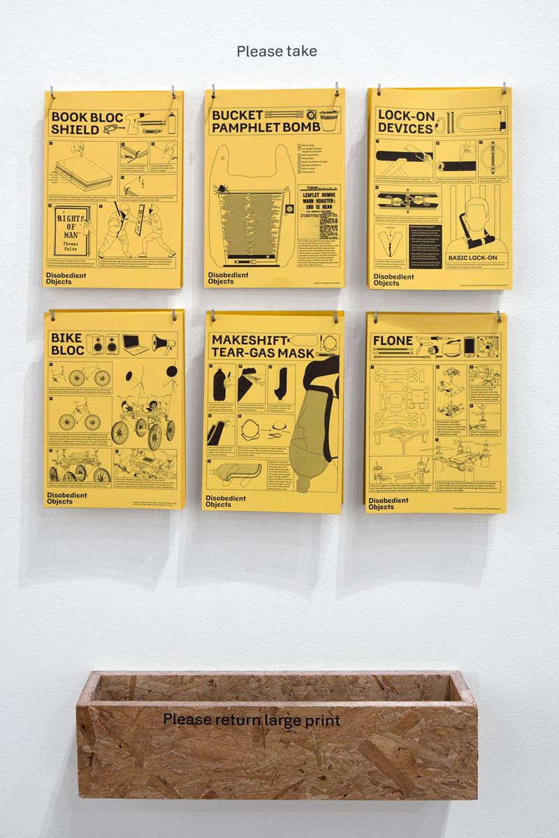 A grid of yellow instructional how-to posters on a wall, headed Please take